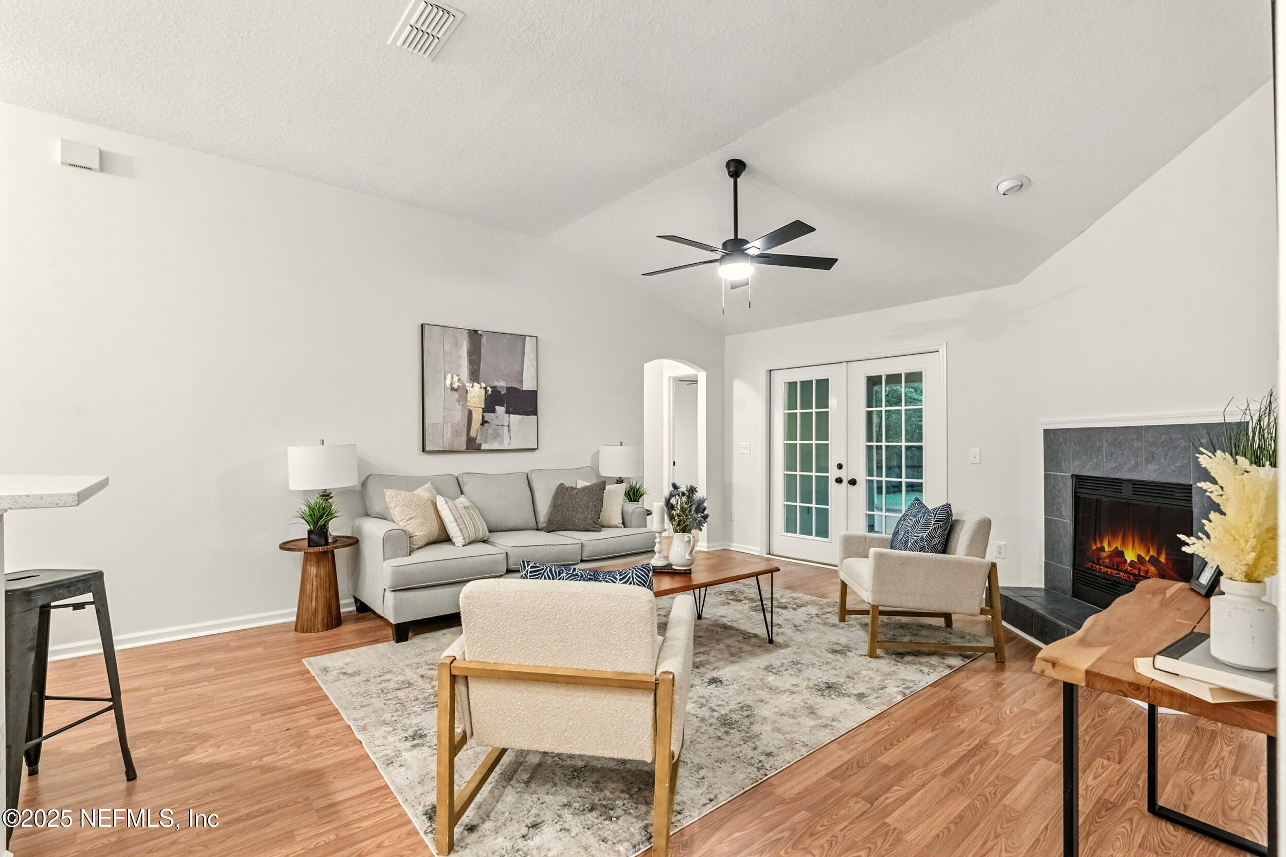 4385 Comanche Trail Boulevard St. Johns, FL 32259 - Photo 5 of 33 a living room with furniture and fireplace
