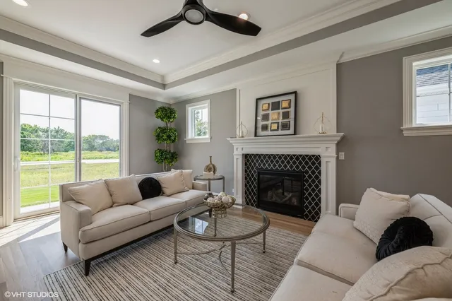 a living room with furniture and a fireplace