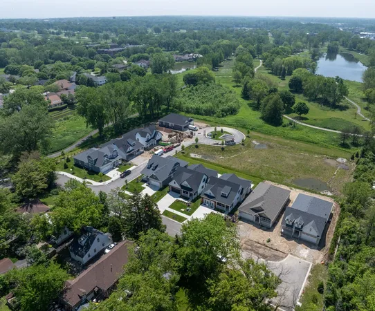 an aerial view of a house with outdoor space