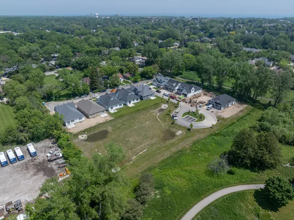 an aerial view of a house with yard