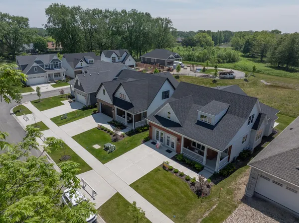 an aerial view of a house with a big yard