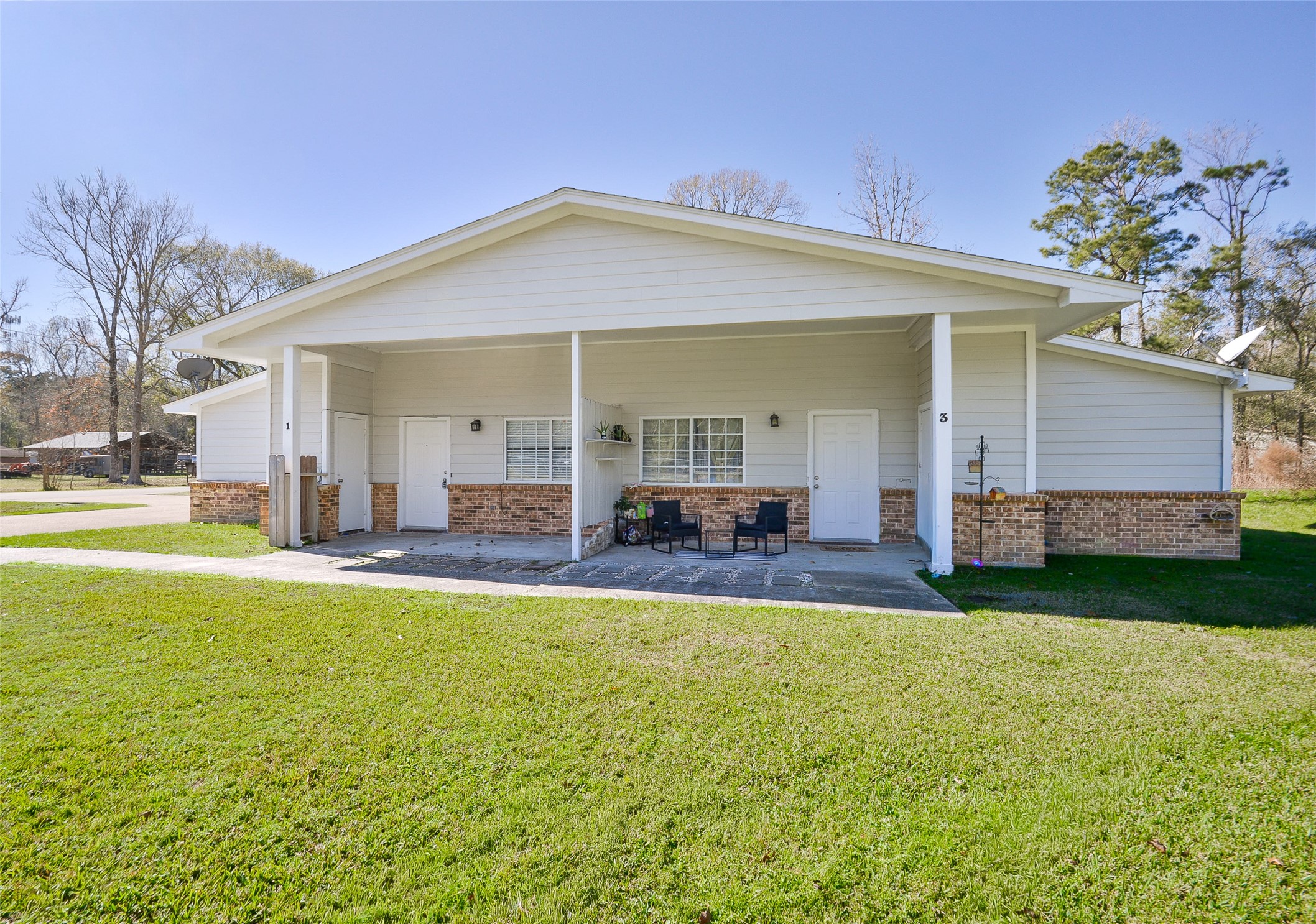 3 Magnolia Lane, Unit 1 Huffman, TX 77336 - Photo 2 of 23 a view of a house with a patio