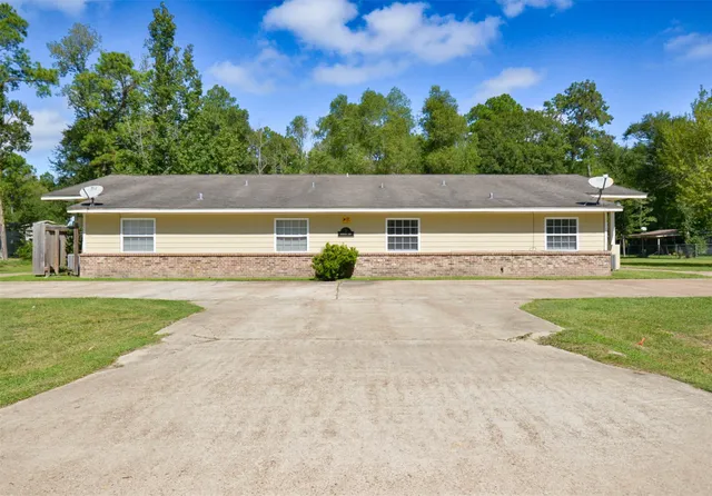 a view of house with outdoor space