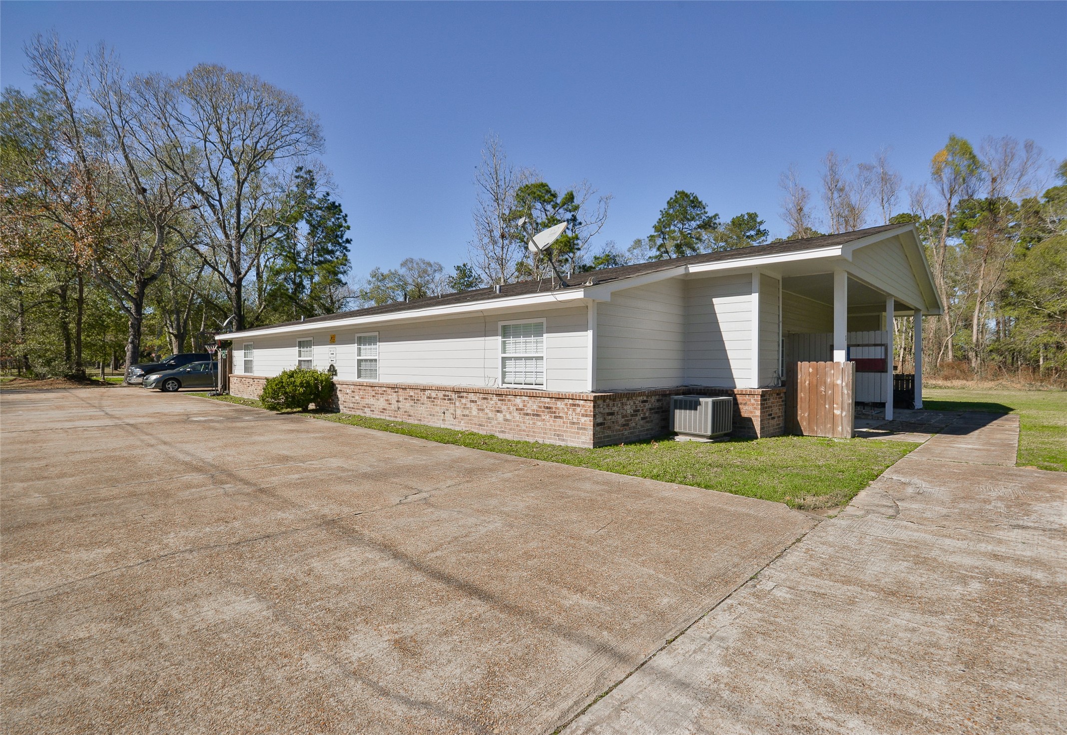 3 Magnolia Lane, Unit 1 Huffman, TX 77336 - Photo 3 of 23 a view of a house with a yard and potted plants