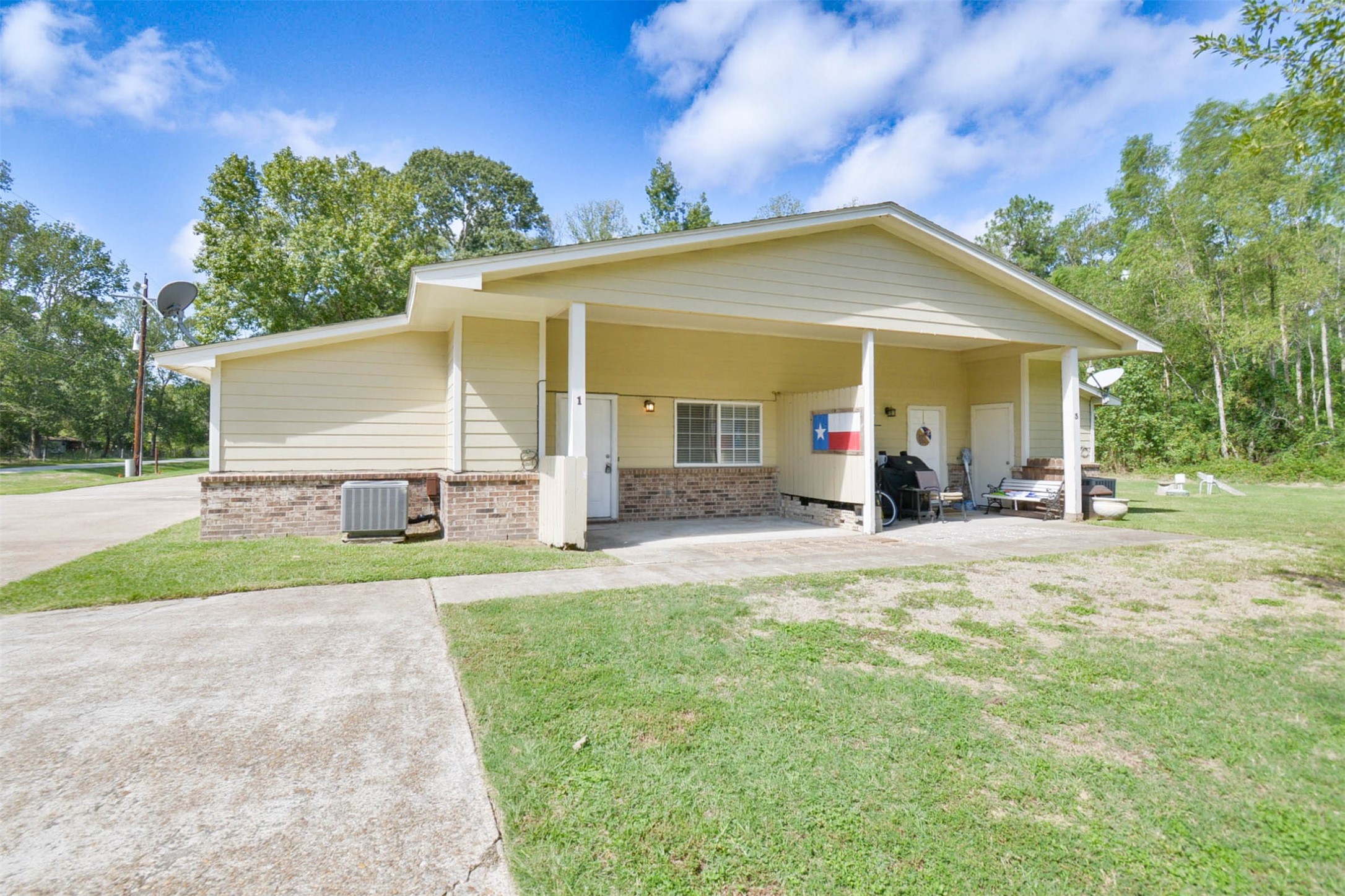 3 Magnolia Lane, Unit 1 Huffman, TX 77336 - Photo 4 of 23 a view of a house with backyard and a tree