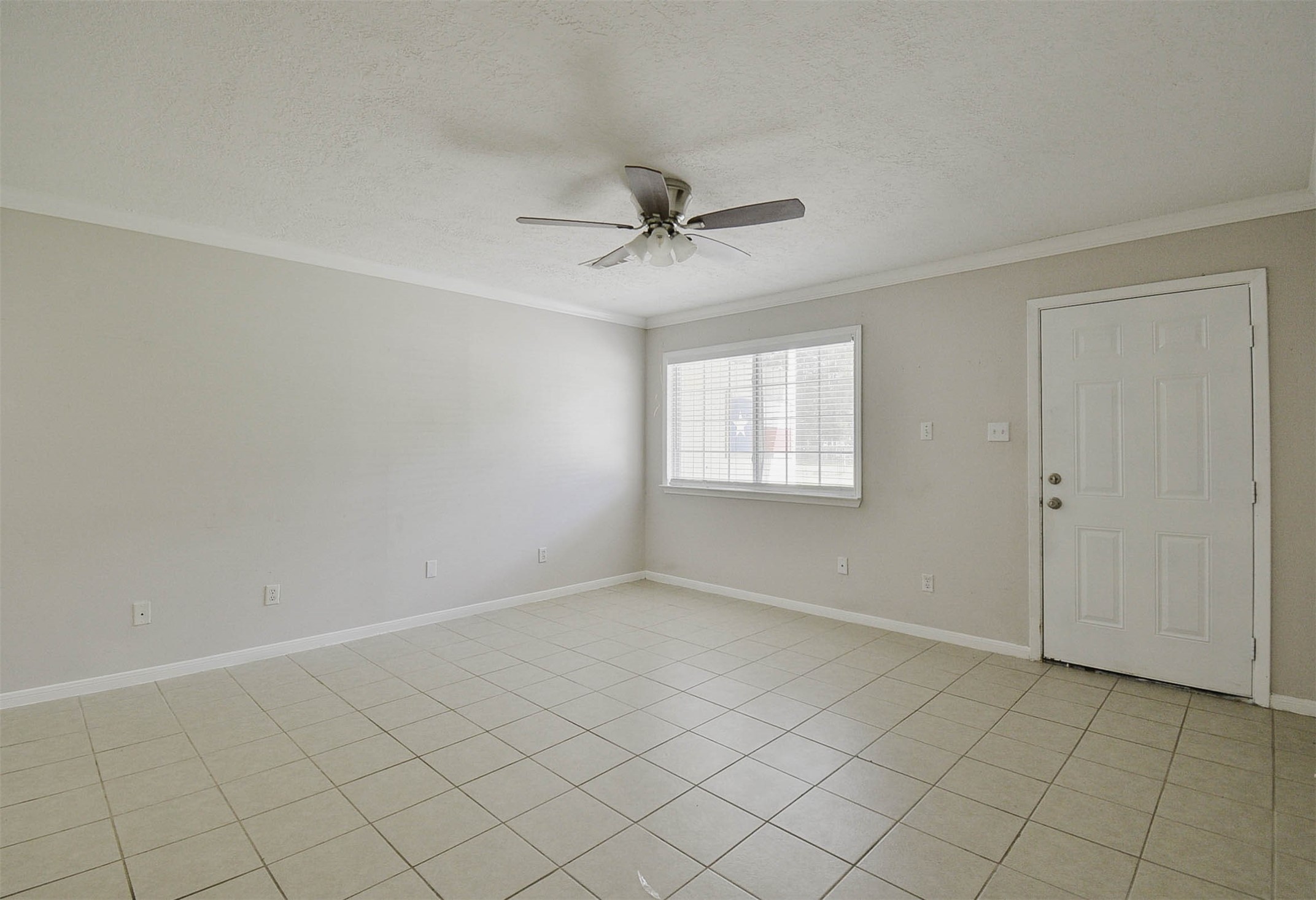 3 Magnolia Lane, Unit 1 Huffman, TX 77336 - Photo 5 of 23 an empty room with windows and fan