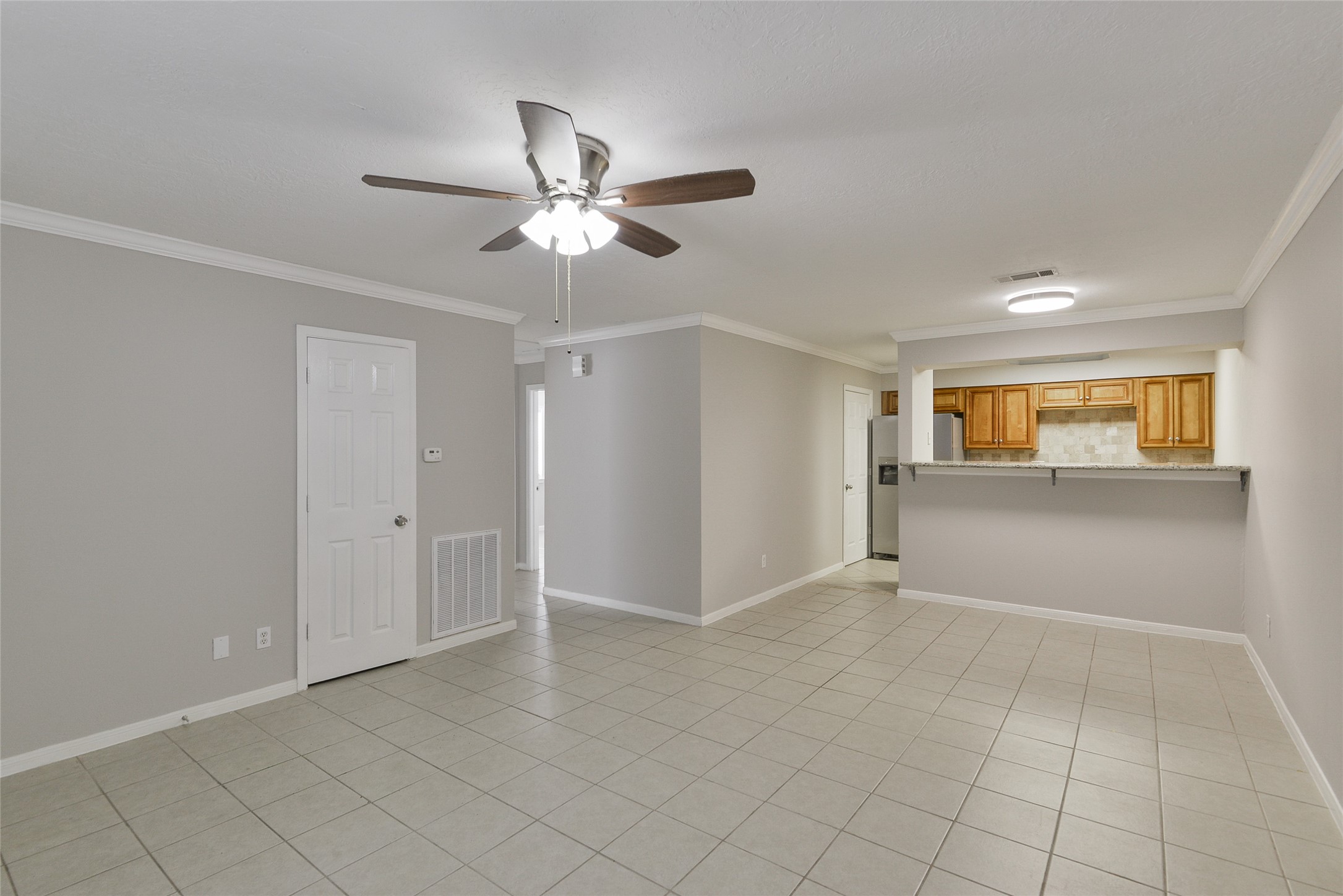 3 Magnolia Lane, Unit 1 Huffman, TX 77336 - Photo 6 of 23 a view of a livingroom with a ceiling fan and entryway