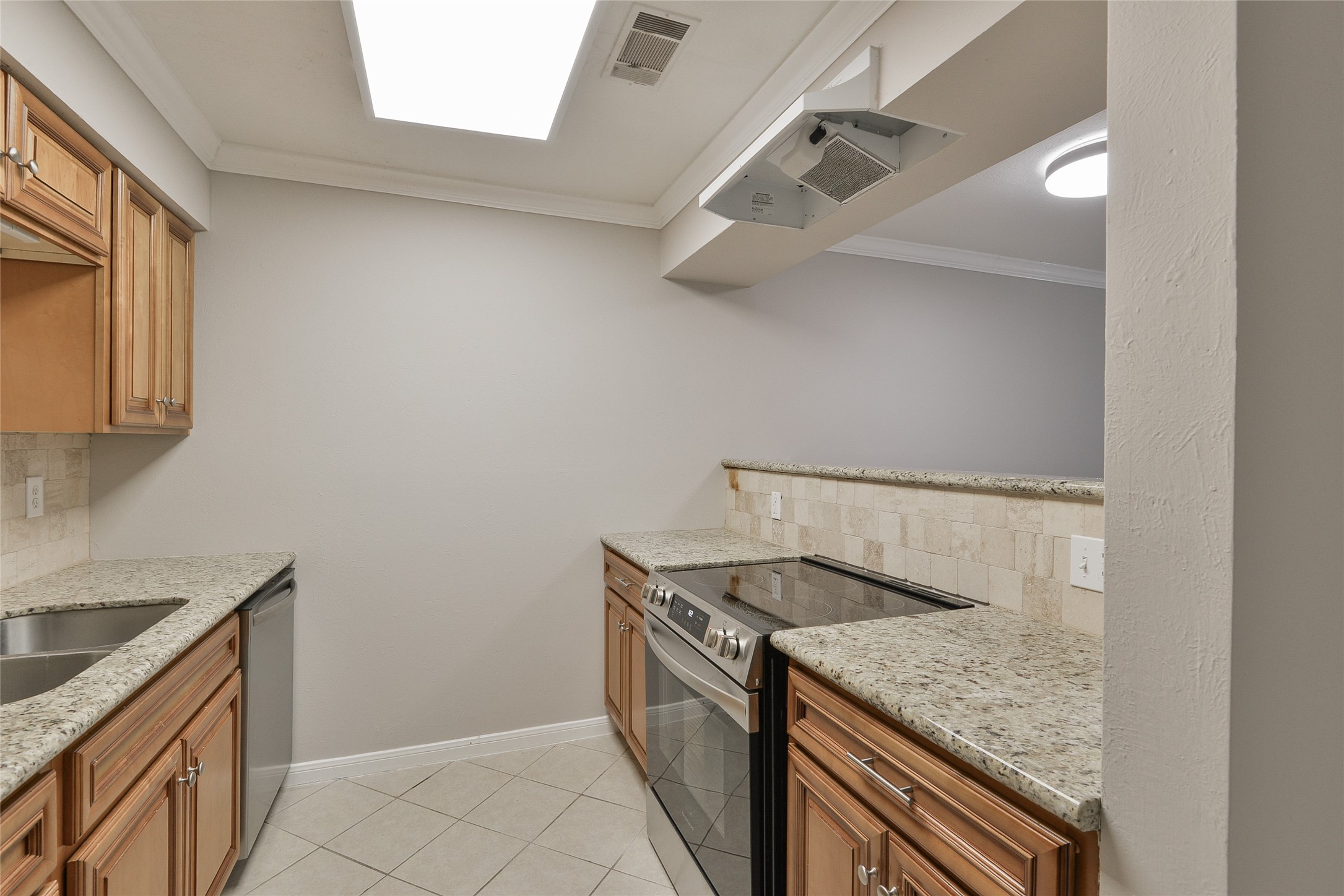3 Magnolia Lane, Unit 1 Huffman, TX 77336 - Photo 9 of 23 a utility room with granite countertop cabinets washer and dryer