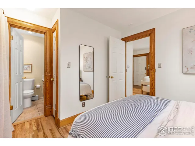 a bedroom with a bed and a bathroom