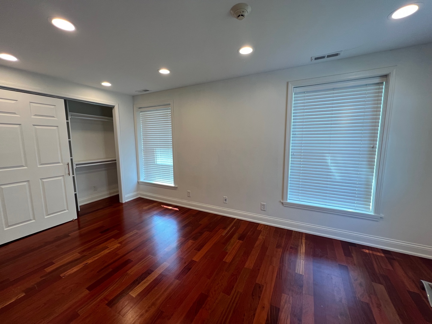 1000 Ridge Road, Unit 2 Wilmette, IL 60091 - Photo 5 of 10 a view of an empty room with wooden floor and a window