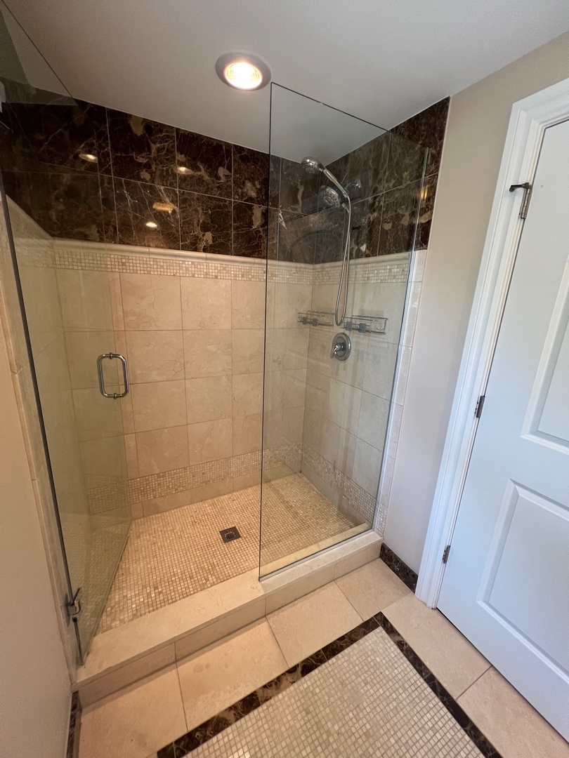 1000 Ridge Road, Unit 2 Wilmette, IL 60091 - Photo 8 of 10 a bathroom with a shower and a sink