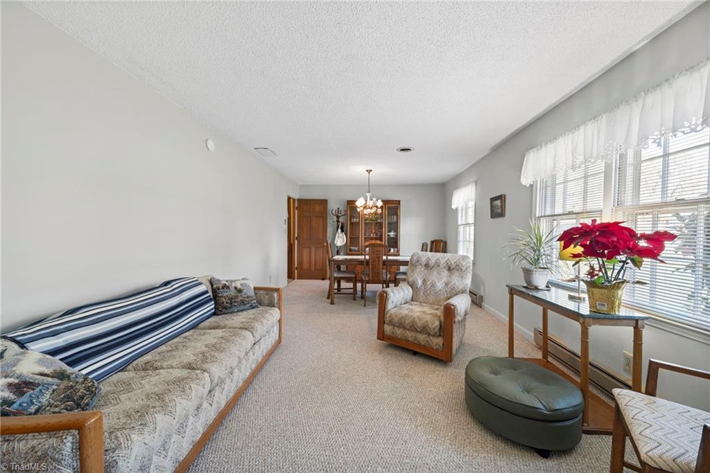 5219 Millstone Road Oak Ridge, NC 27310 - Photo 13 of 37 Living room with great natural light.