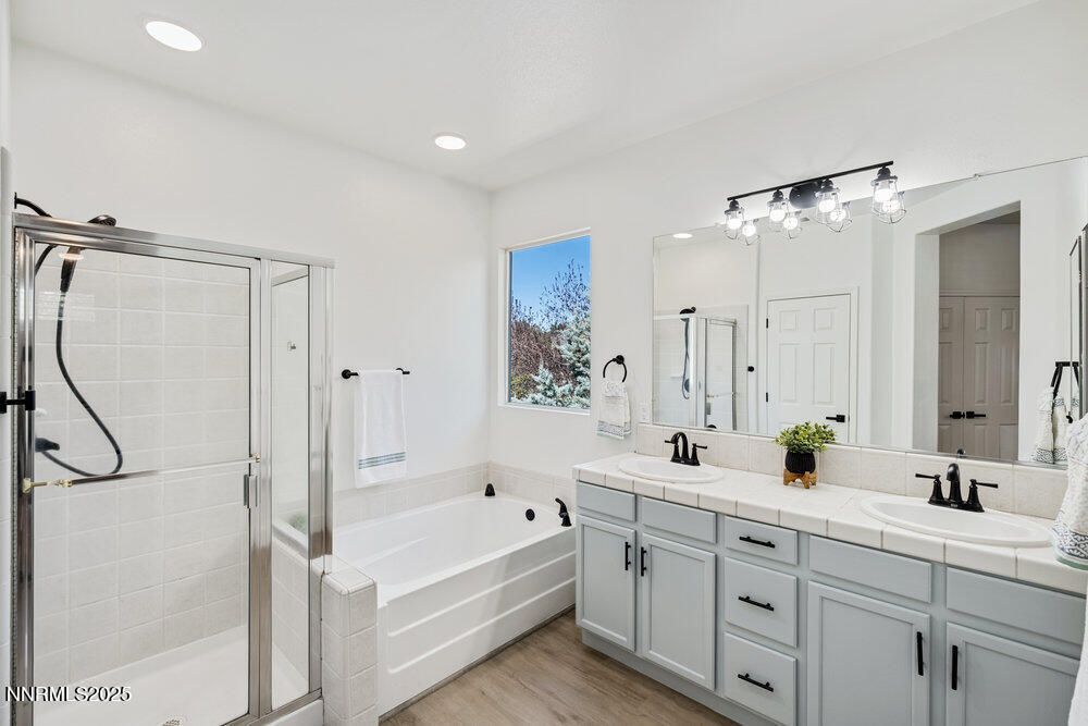1179 Tule Drive Reno, NV 89521 - Photo 25 of 48 a bathroom with a double vanity sink mirror double and shower