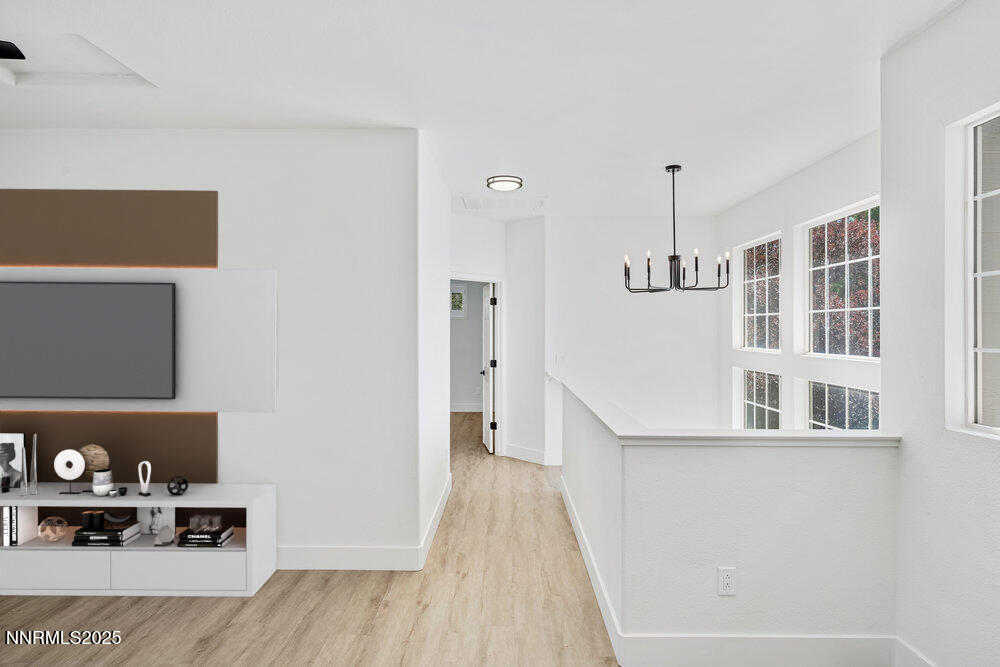 1179 Tule Drive Reno, NV 89521 - Photo 33 of 48 a view of a hallway with wooden floor and living room