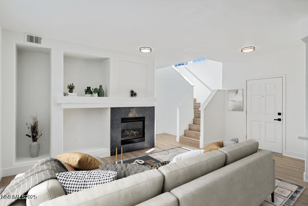 1179 Tule Drive Reno, NV 89521 - Photo 8 of 48 a living room with furniture and a fireplace