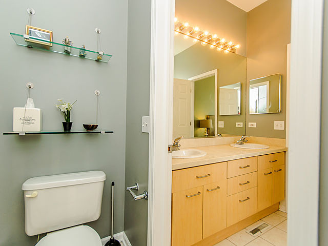 2127 West Rice Street, Unit 4W Chicago, IL 60622 - Photo 18 of 25 a bathroom with a toilet sink and mirror