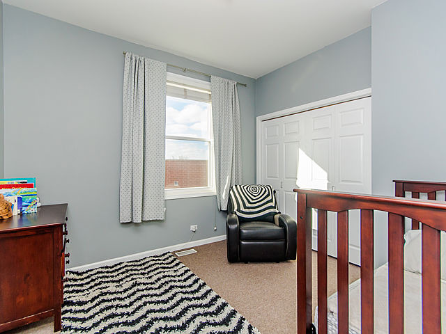2127 West Rice Street, Unit 4W Chicago, IL 60622 - Photo 21 of 25 a bedroom with furniture and a window