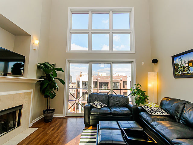 2127 West Rice Street, Unit 4W Chicago, IL 60622 - Photo 3 of 25 a living room with furniture fireplace and flat screen tv