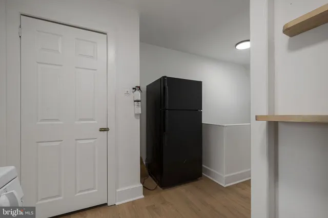 an empty room with wooden floor