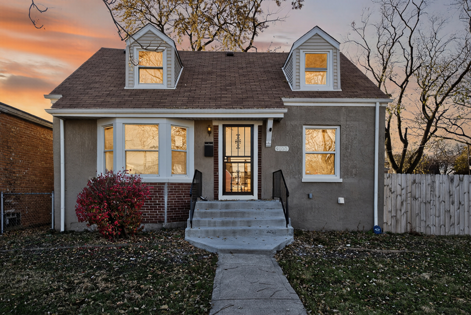a front view of a house with garden