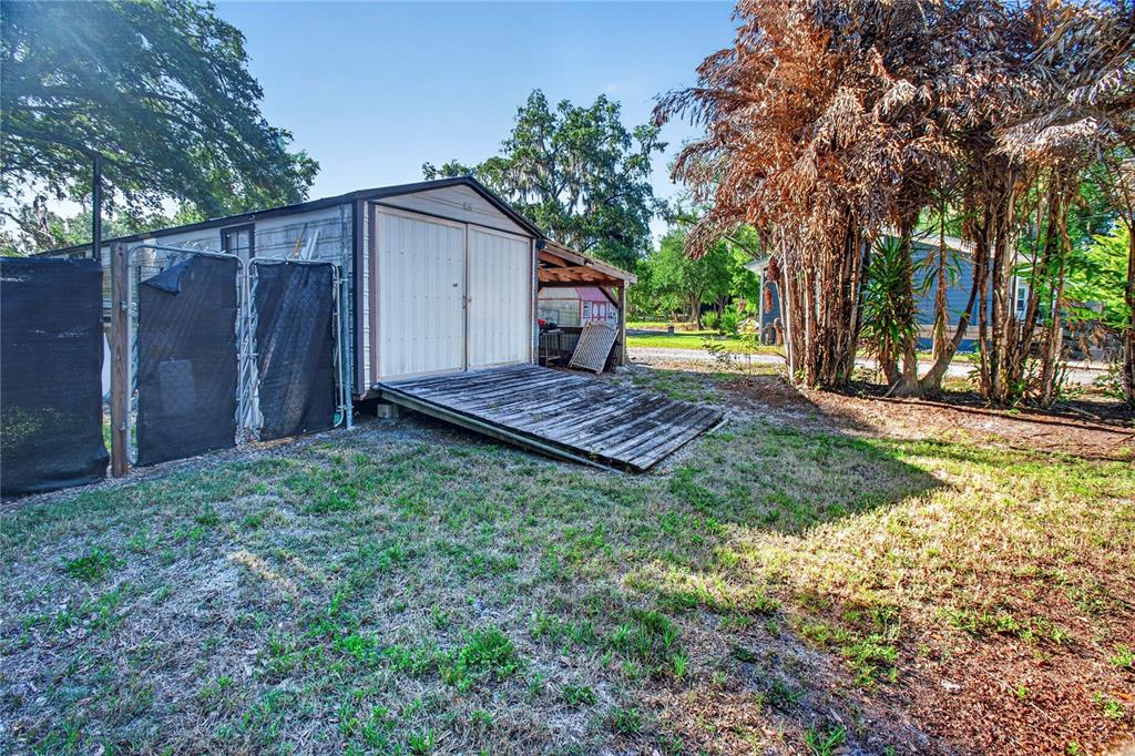 10627 McIntosh Road Thonotosassa, FL 33592 - Photo 21 of 38 a view of backyard with green space