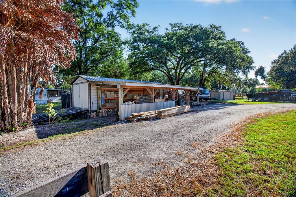 10627 McIntosh Road Thonotosassa, FL 33592 - Photo 32 of 38 a view of house with outdoor space and sitting area