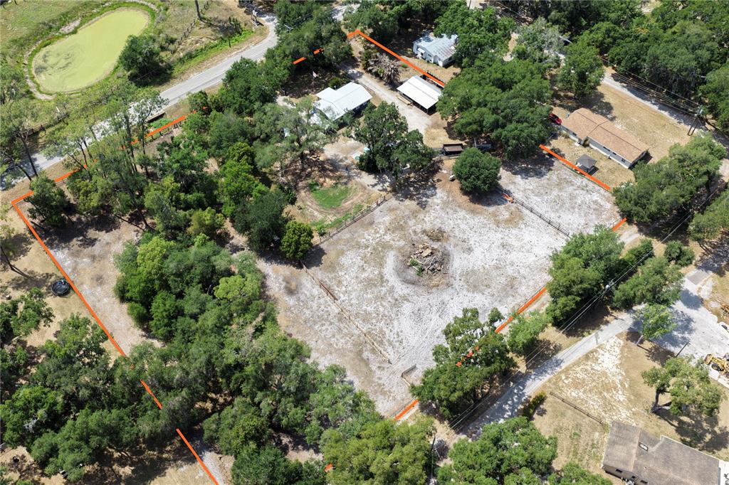 10627 McIntosh Road Thonotosassa, FL 33592 - Photo 38 of 38 an aerial view of a house with a yard and greenery