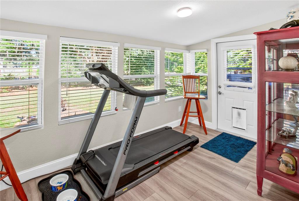 10627 McIntosh Road Thonotosassa, FL 33592 - Photo 9 of 38 a view of a room with gym equipment