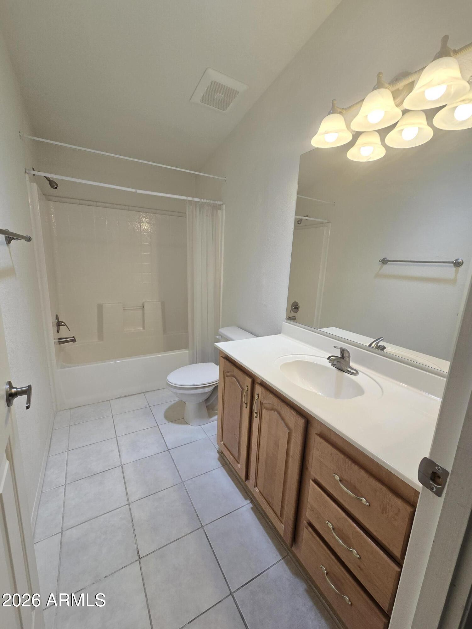 3301 South Goldfield Road, Unit 3004 Apache Junction, AZ 85119 - Photo 28 of 67 a spacious bathroom with a sink a toilet and a mirror