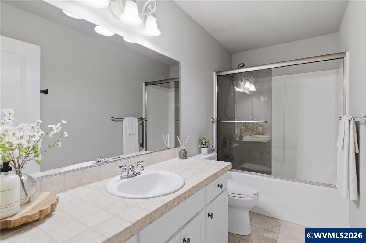 2359 Northwest Gale Street Albany, OR 97321 - Photo 35 of 47 a bathroom with a granite countertop sink toilet and shower