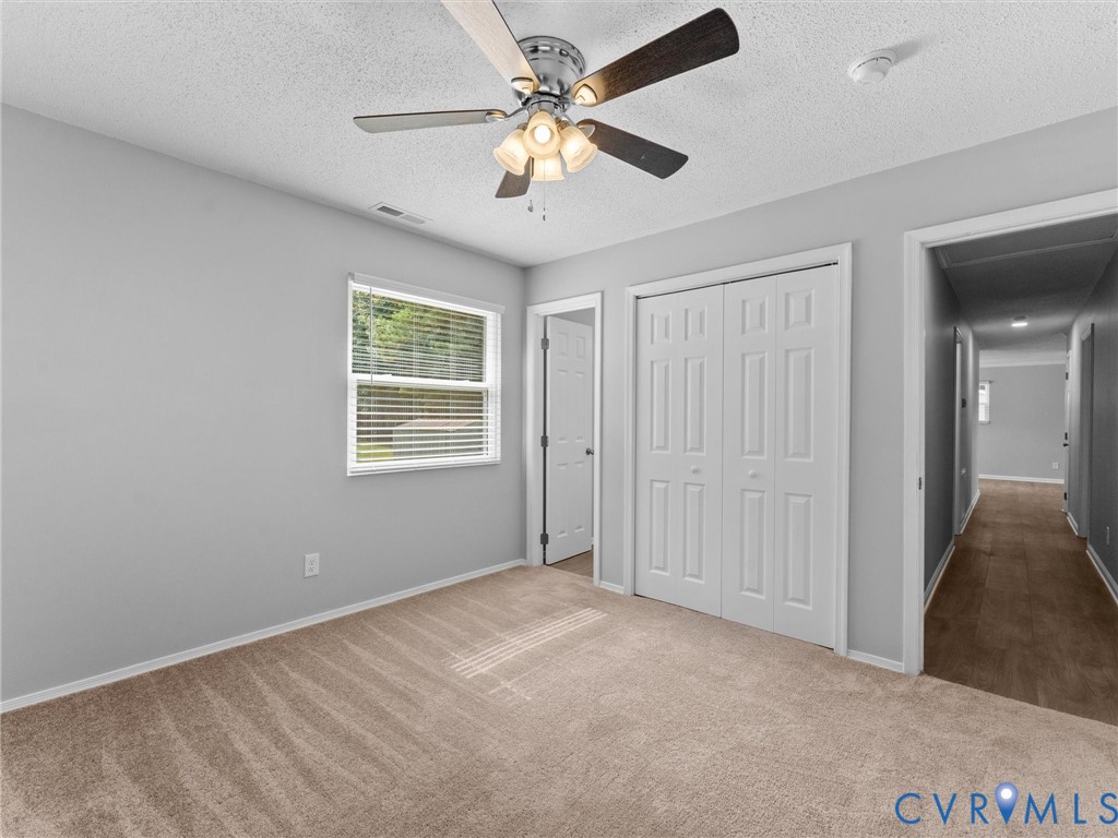 6927 Carsley Road Waverly, VA 23890 - Photo 27 of 51 Carpeted flooring, window with blinds, ceiling fan