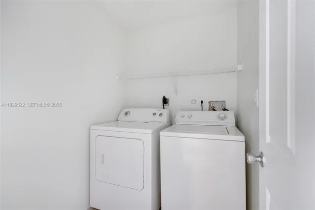 a utility room with dryer and washer