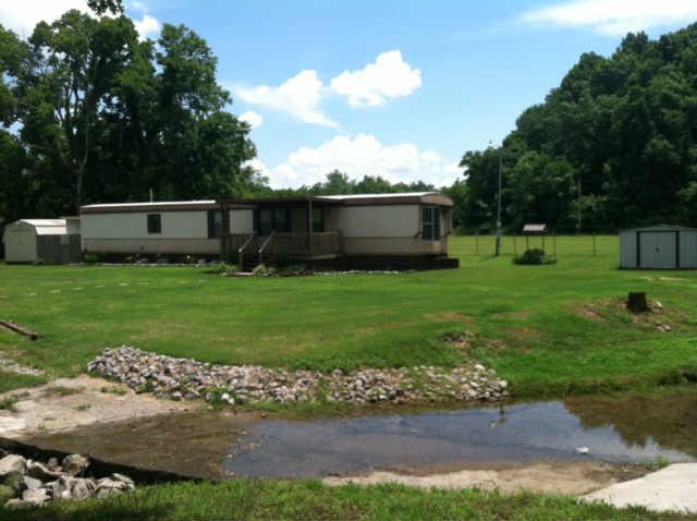 8217 Pickard Hollow Road Mount Pleasant, TN 38474 - Photo 1 of 12 CREEK RUNNING OVER DRIVE WAY IN FRONT OF HOME
