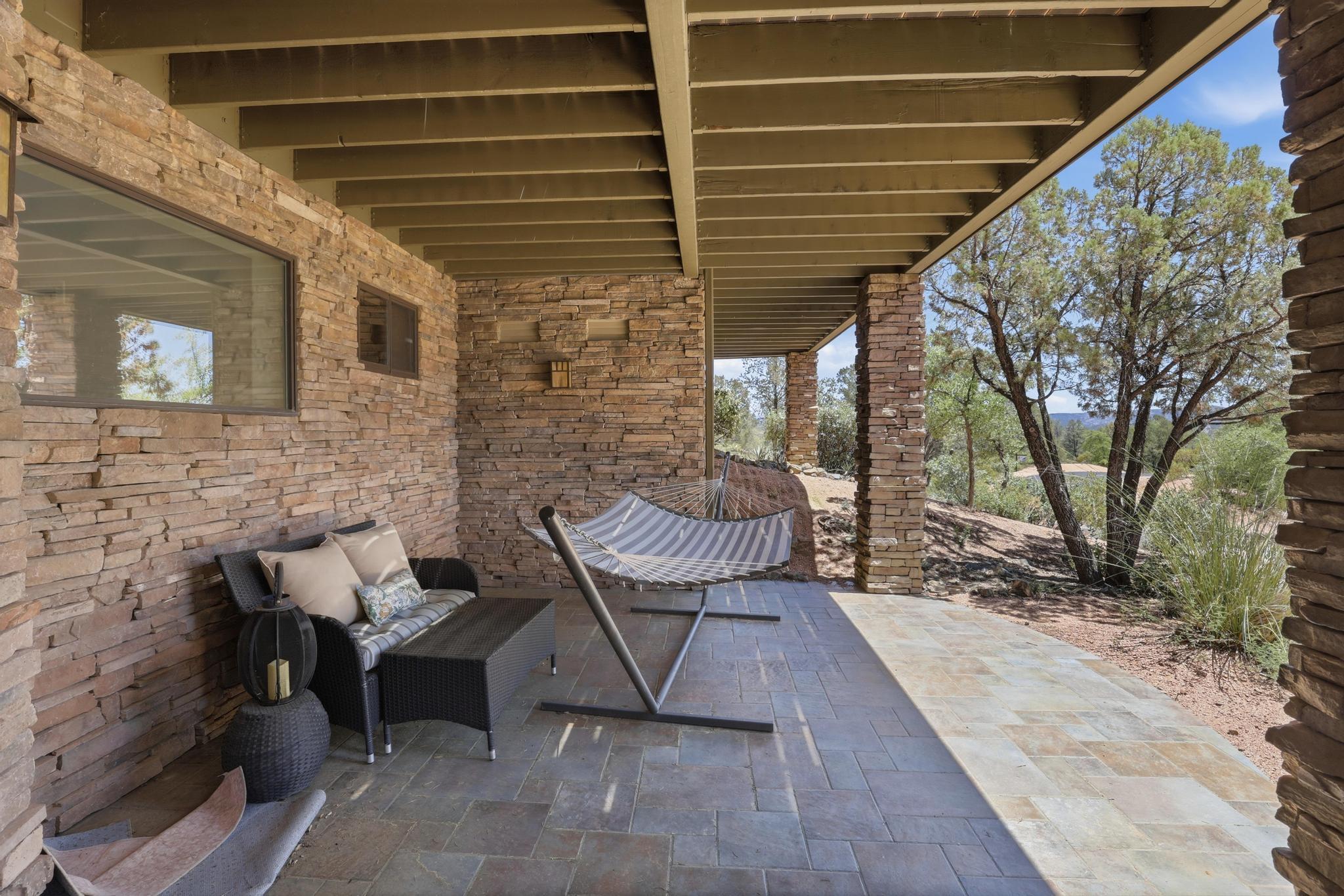 2908 East Rim Club Drive Payson, AZ 85541 - Photo 47 of 77 a view of a patio with couple of chairs and potted plants