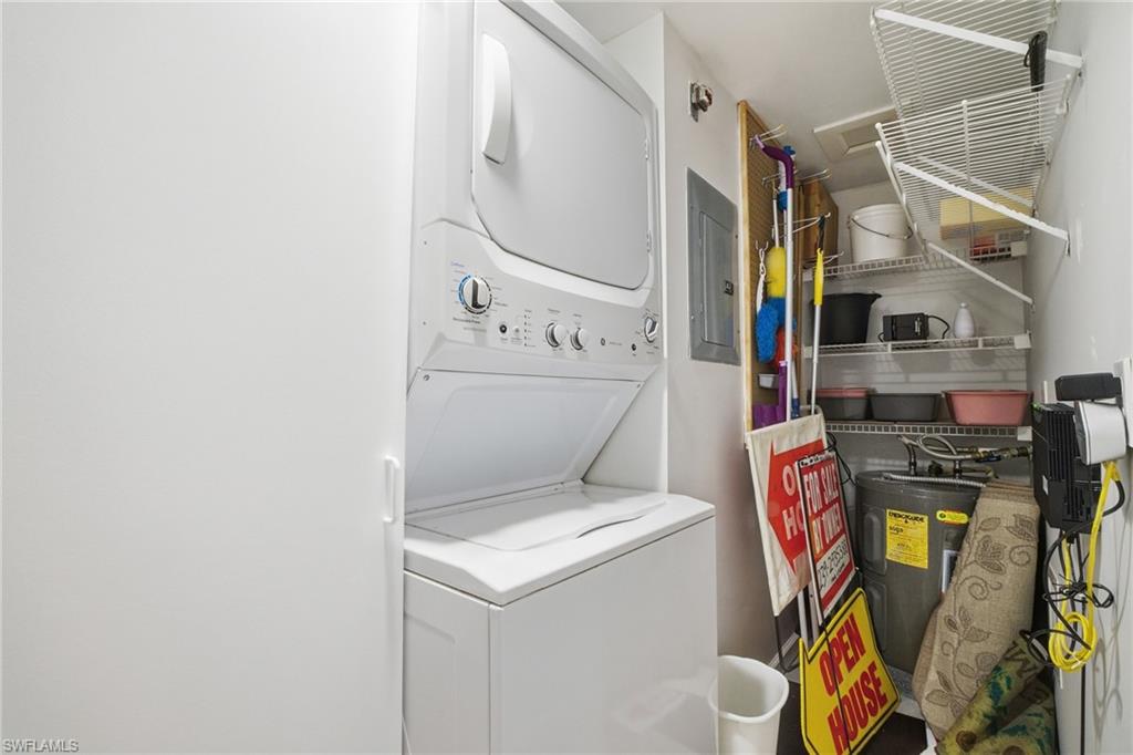 1001 Eastham Way, Unit C102 Naples, FL 34104 - Photo 19 of 41 a utility room with dryer and washer