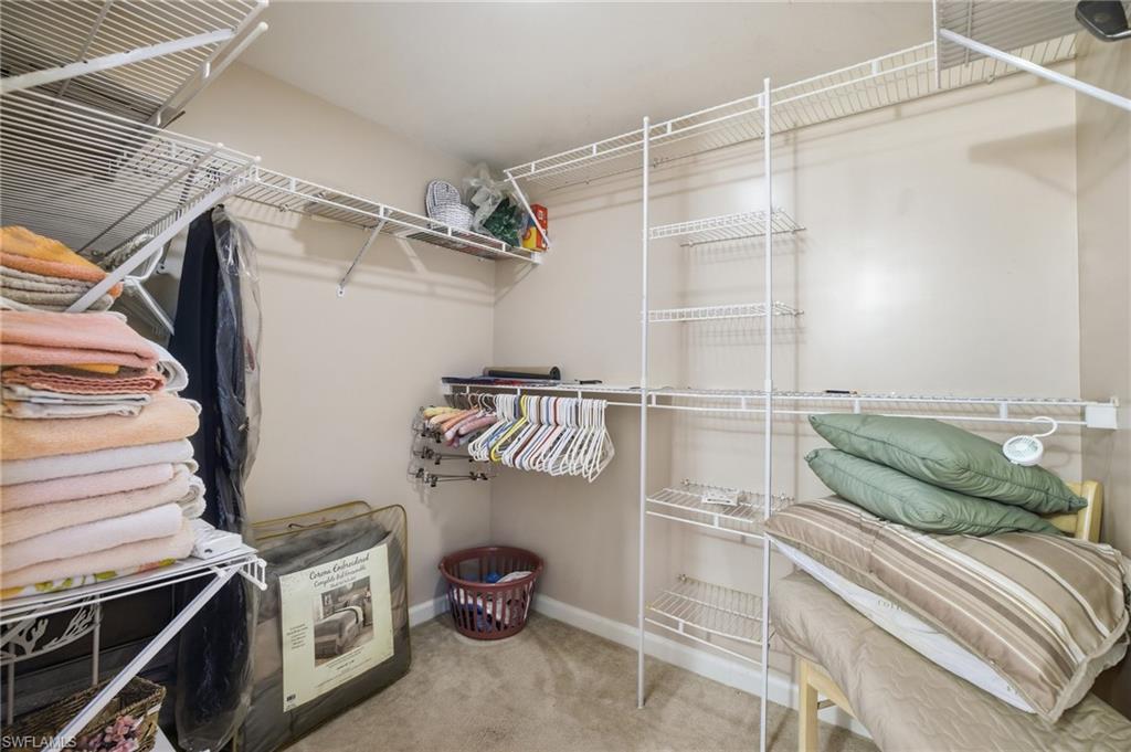 1001 Eastham Way, Unit C102 Naples, FL 34104 - Photo 25 of 41 a kitchen with a refrigerator and a stove