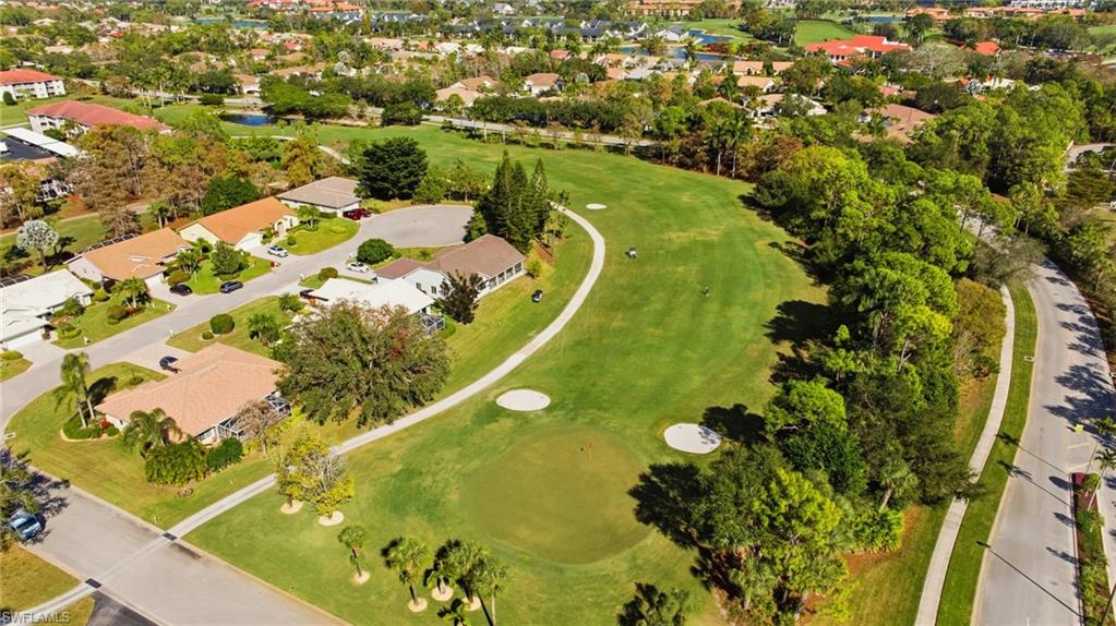 1001 Eastham Way, Unit C102 Naples, FL 34104 - Photo 29 of 41 an aerial view of a residential houses with swimming pool