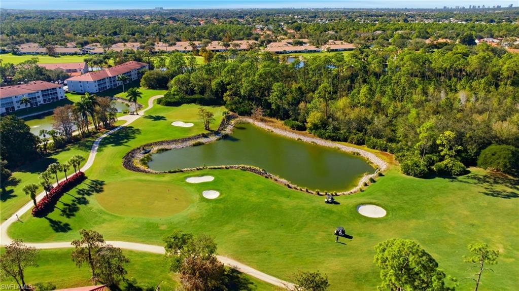 1001 Eastham Way, Unit C102 Naples, FL 34104 - Photo 30 of 41 an aerial view of a residential houses with outdoor space and trees