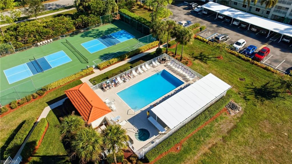 1001 Eastham Way, Unit C102 Naples, FL 34104 - Photo 31 of 41 an aerial view of a house with a yard and outdoor seating