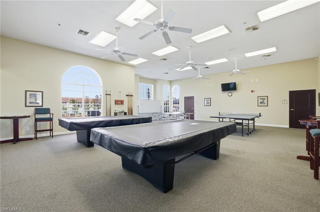 1001 Eastham Way, Unit C102 Naples, FL 34104 - Photo 34 of 41 a large kitchen with a large counter space a sink appliances and a large window