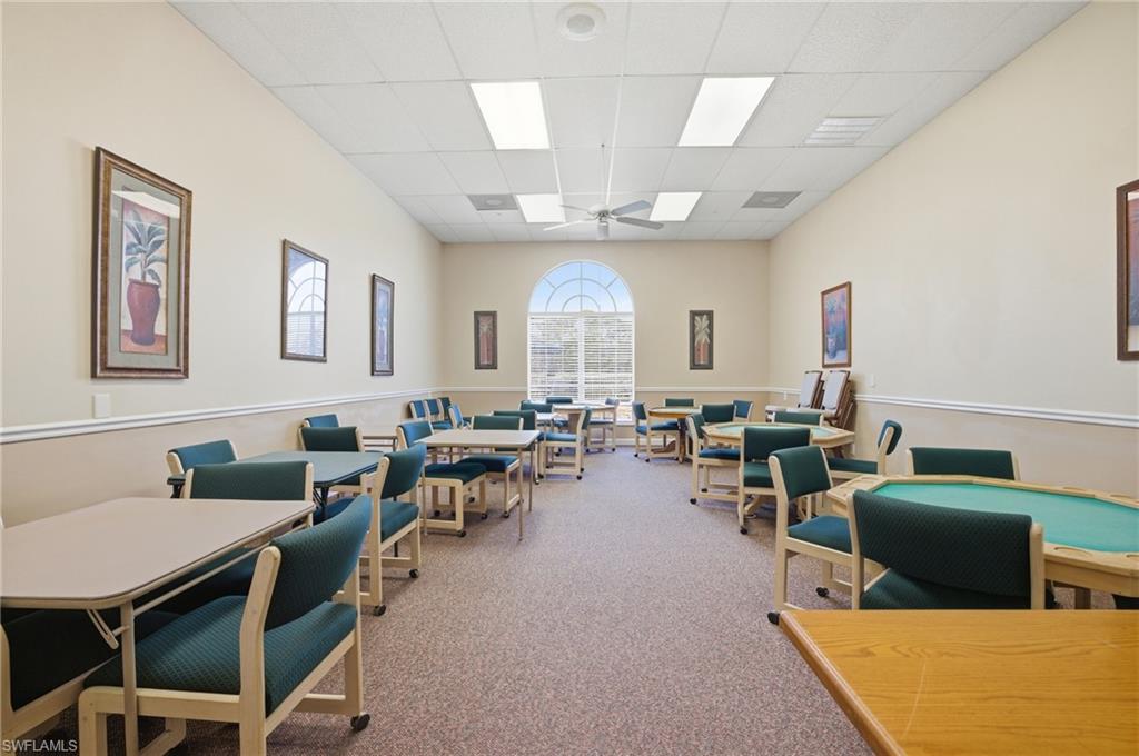1001 Eastham Way, Unit C102 Naples, FL 34104 - Photo 35 of 41 a view of a livingroom with furniture and a large window