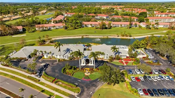 an aerial view of a house with swimming pool and outdoor seating