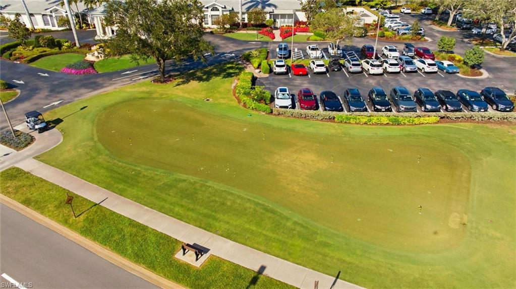 1001 Eastham Way, Unit C102 Naples, FL 34104 - Photo 37 of 41 a view of a swimming pool with an outdoor space