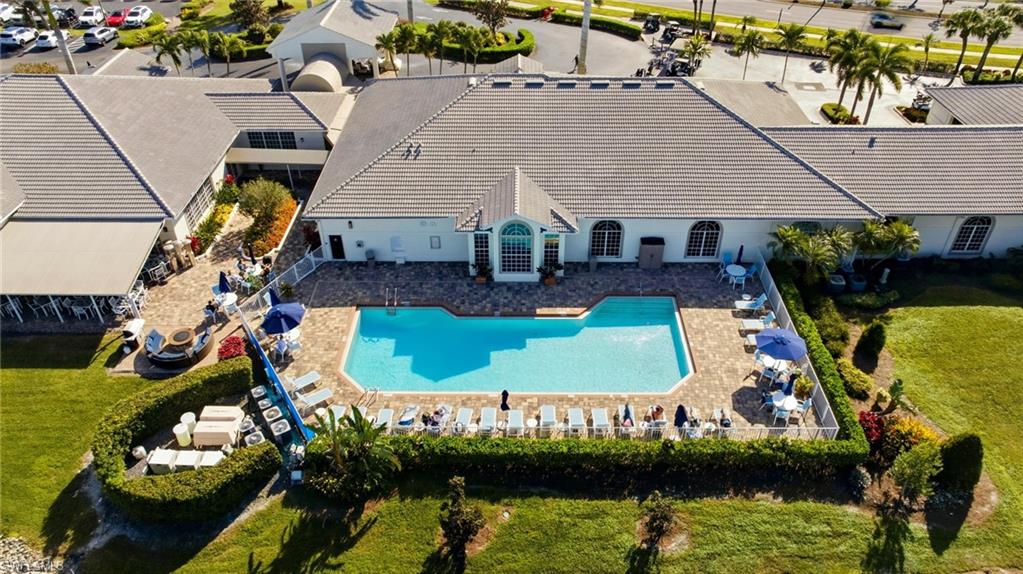 1001 Eastham Way, Unit C102 Naples, FL 34104 - Photo 40 of 41 an aerial view of a house with swimming pool and outdoor seating