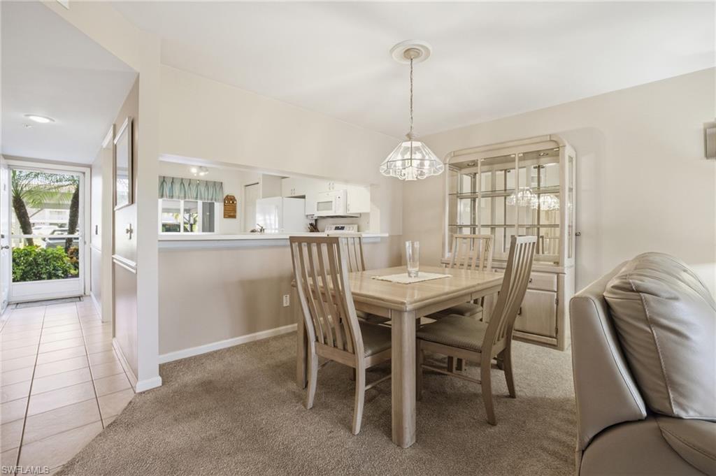 1001 Eastham Way, Unit C102 Naples, FL 34104 - Photo 9 of 41 a view of a dining room and a livingroom