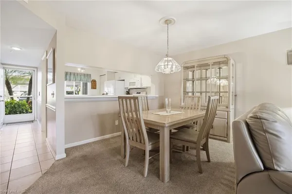 a dining room with a table and chairs