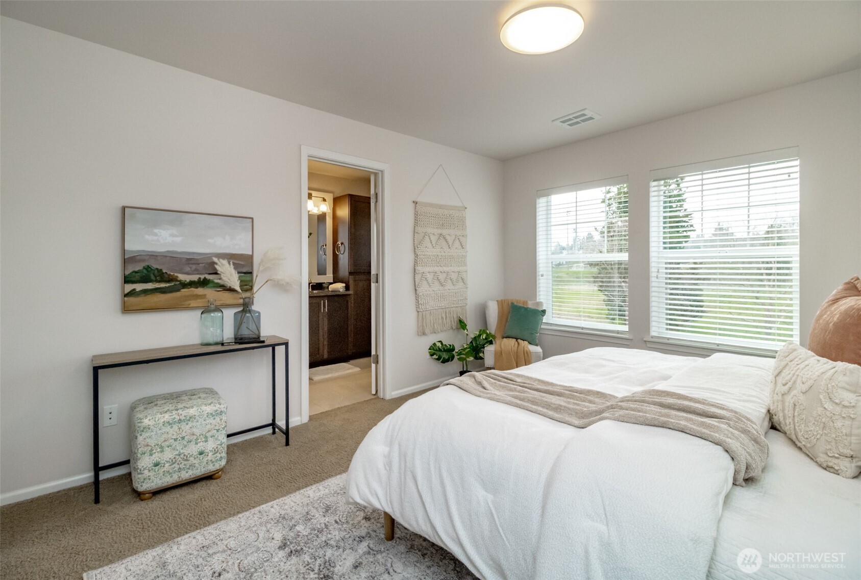 6830 31st Avenue Southwest Seattle, WA 98126 - Photo 17 of 28 a bedroom with a bed and a painting on the wall