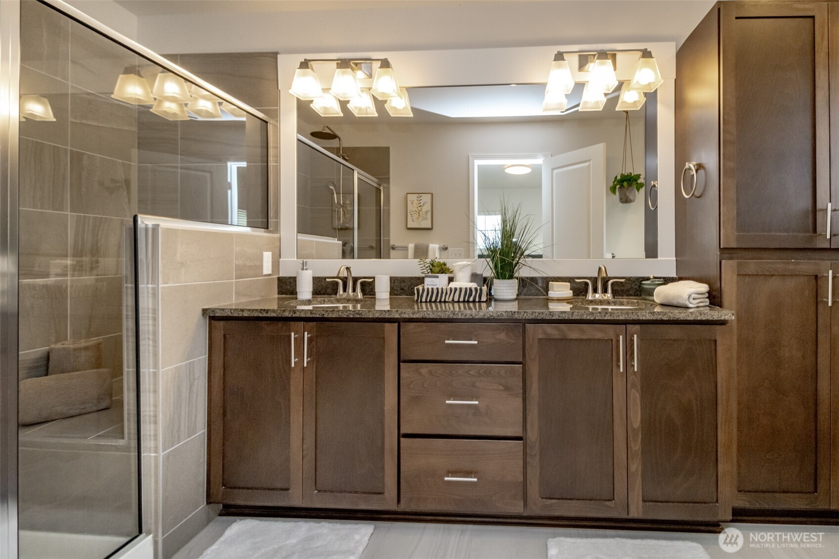 6830 31st Avenue Southwest Seattle, WA 98126 - Photo 18 of 28 a bathroom with a sink and a mirror