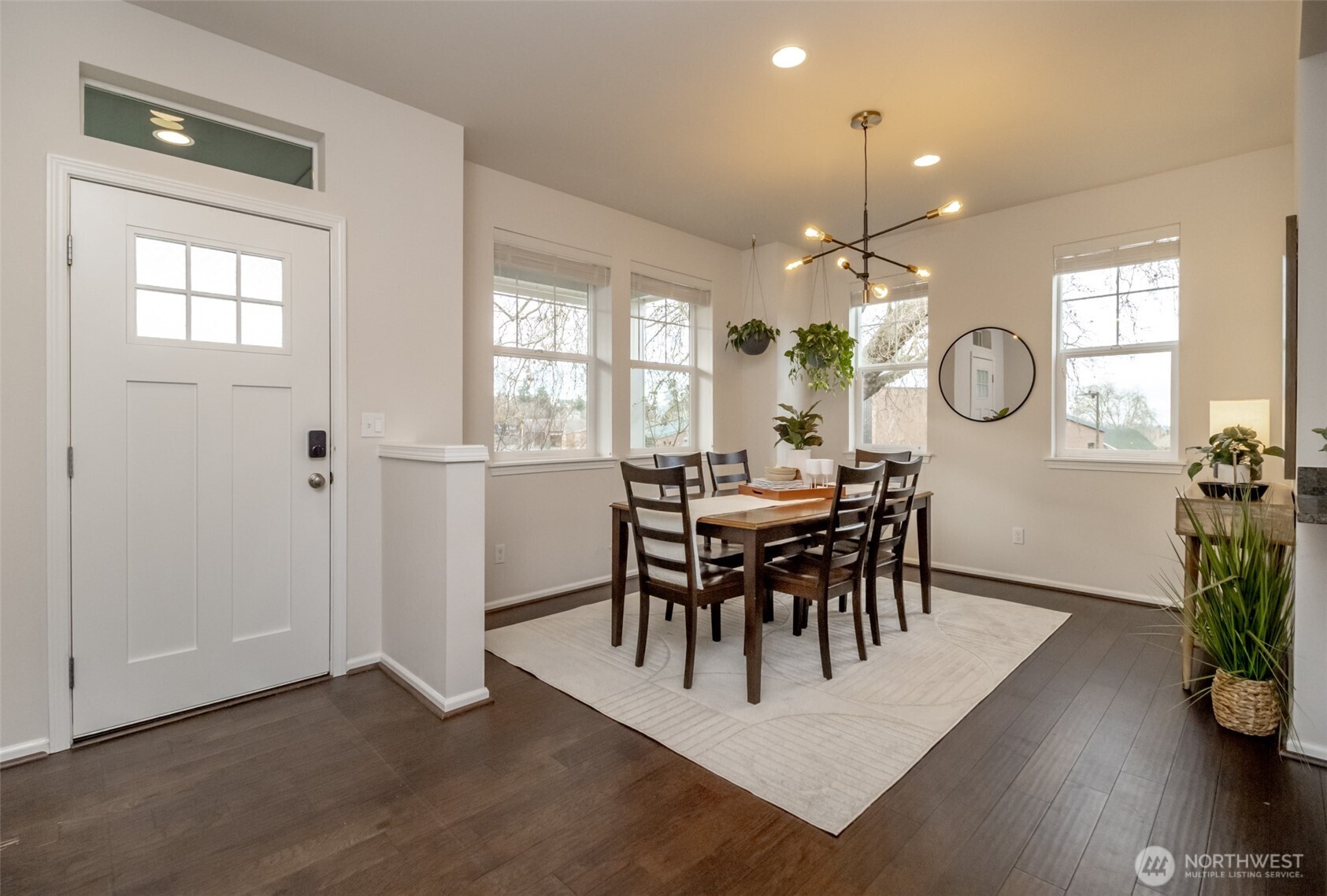 6830 31st Avenue Southwest Seattle, WA 98126 - Photo 5 of 28 a view of a dining room with furniture and wooden floor
