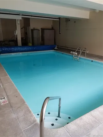 a terrace with outdoor seating and city view
